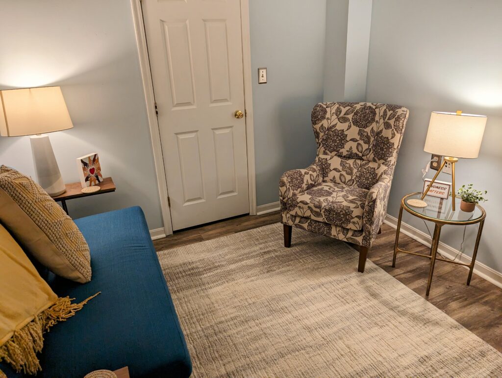 Cozy chair and a loveseat available for being comfortable while doing the hard work of couples therapy.