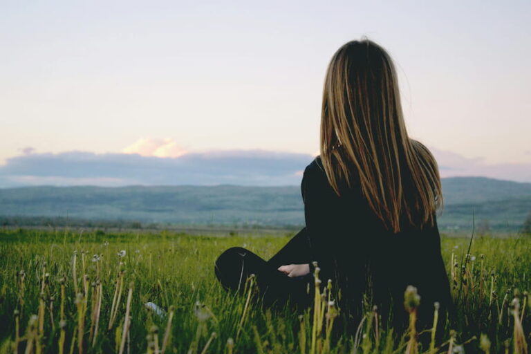 a woman alone in a field