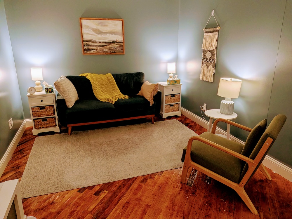 Couch and chair in a cozy therapy office