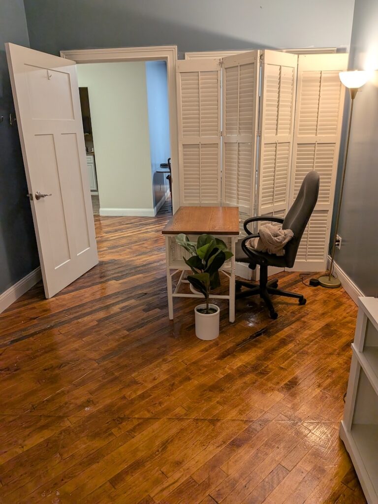 Therapist desk and chair by the door